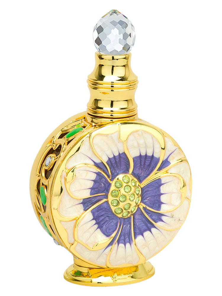 Decorative perfume bottle with floral design and gold accents on a white background