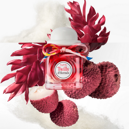 Hermes Tutti Twilly d'Hermes perfume bottle with red flowers on a white background