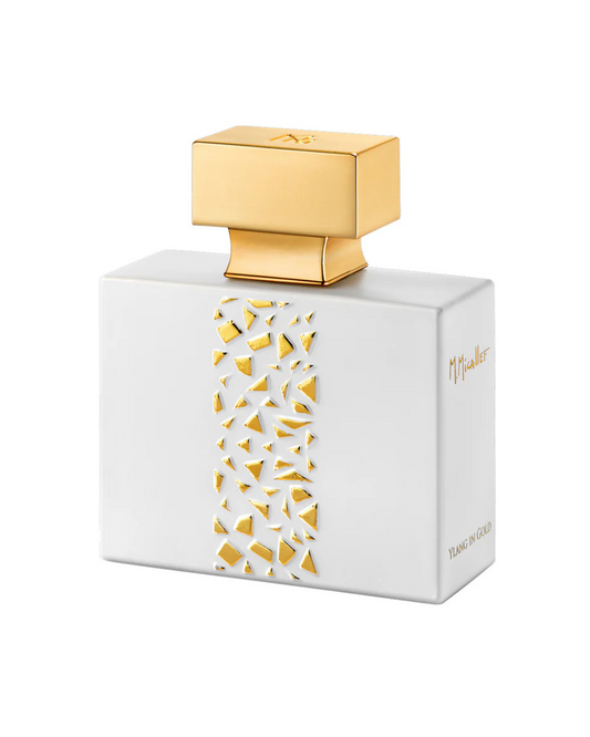 Perfume bottle with gold cap and geometric design on white background