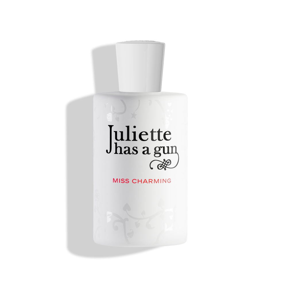 Perfume bottle labeled 'Juliette has a gun Miss Charming' on a white background