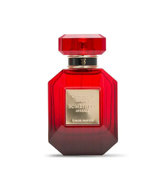 Red perfume bottle with gold accents on a white background