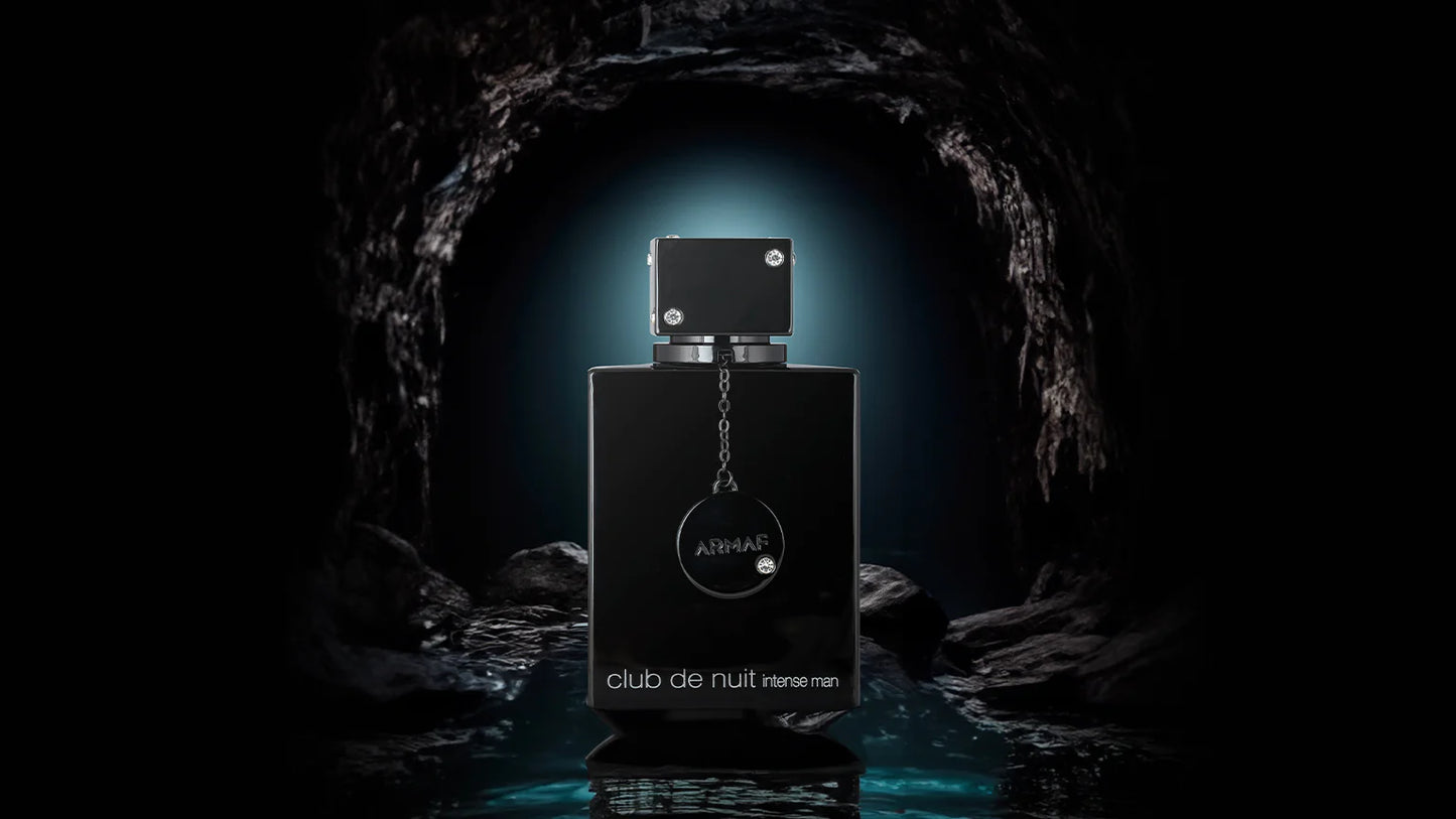Black perfume bottle with a chain on a dark background