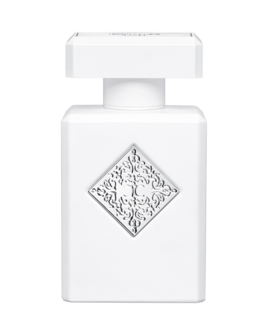 Initio Rehab White perfume bottle with intricate design on a white background