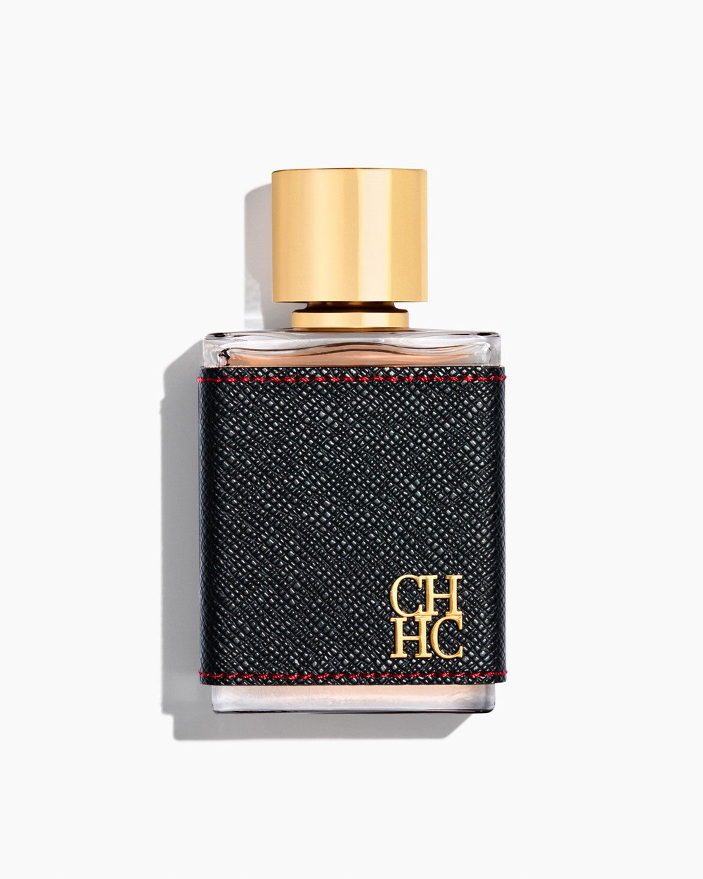 Perfume bottle with gold cap and black label on a white background