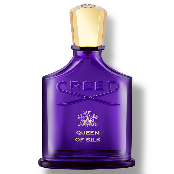 Purple Creed perfume bottle with gold cap on a white background