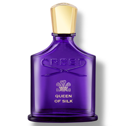 Purple Creed perfume bottle with gold cap on a white background